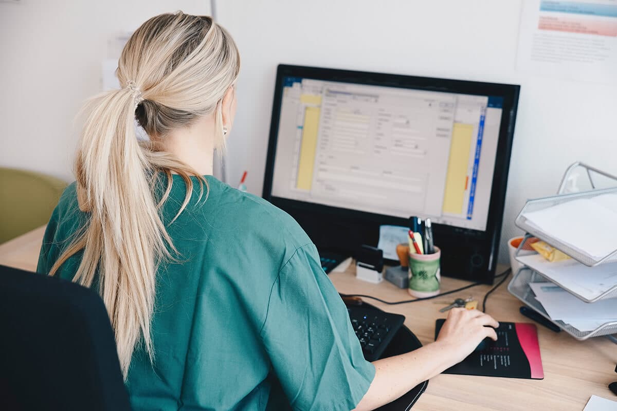 Female call handler on computer